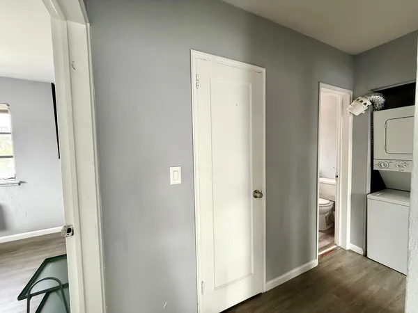 a view of a bathroom with a sink and a mirror