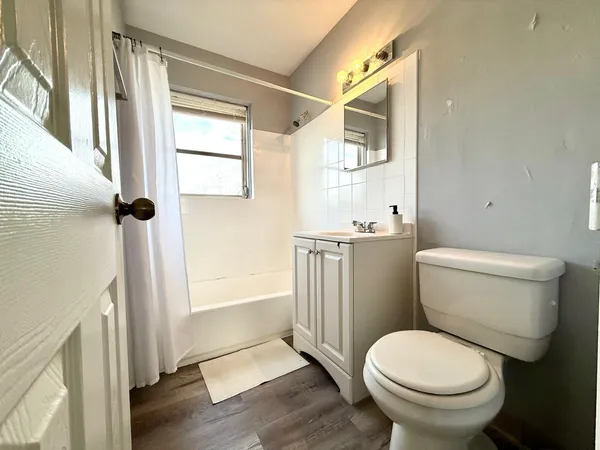 a bathroom with a toilet and a sink
