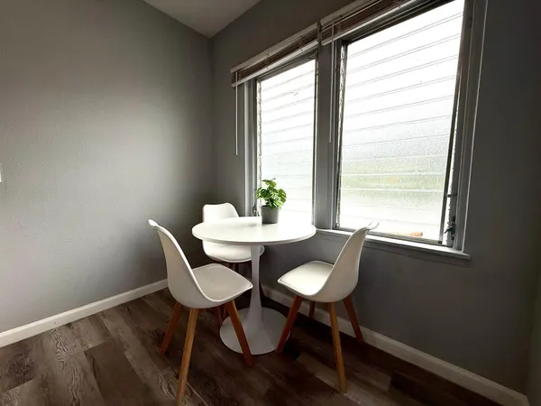 a view of a dining room with furniture window and outside view