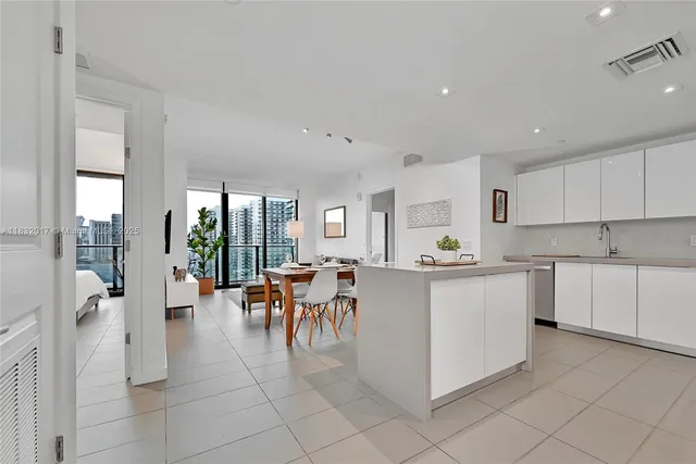 a living room with furniture a dining table and chairs