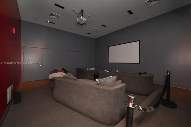 a lobby with furniture and floor to ceiling window