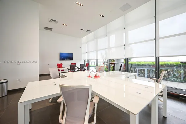 a view of a big room with closet and windows