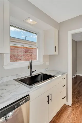 a kitchen with a sink and cabinets