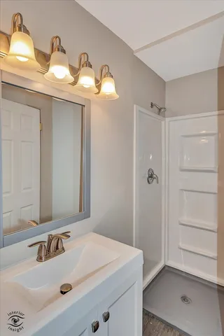 a bathroom with a sink and a mirror