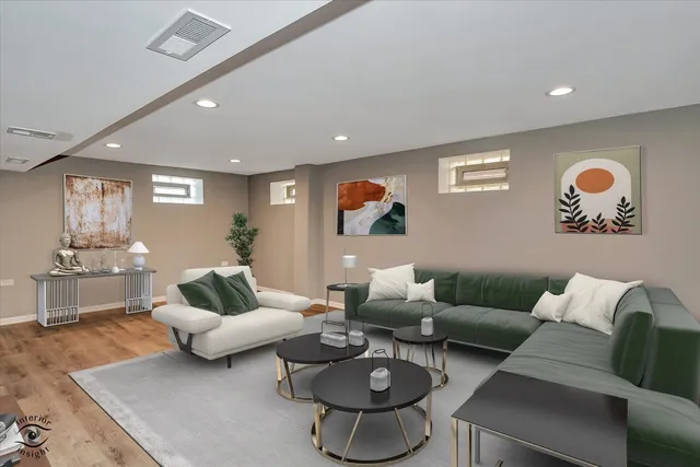 a living room with furniture and wooden floor