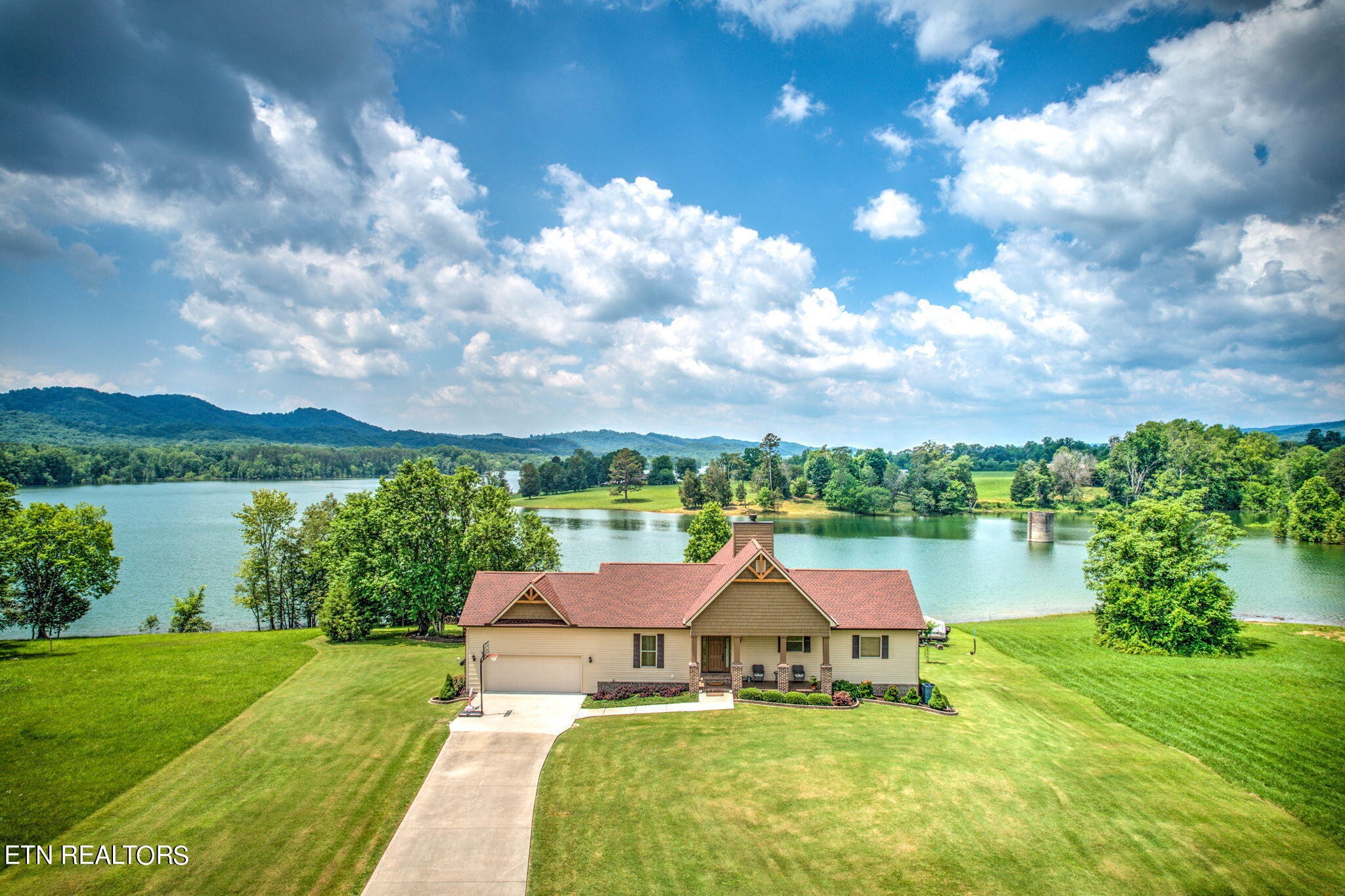 296 Shields Crossing Drive Bean Station, TN 37708 - Photo 1 of 52 a front view of a house with garden