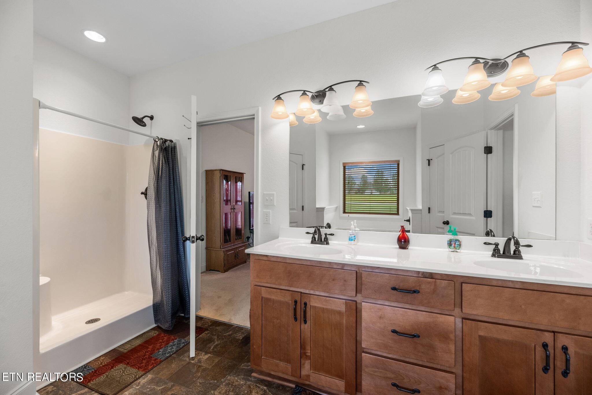296 Shields Crossing Drive Bean Station, TN 37708 - Photo 17 of 52 a bathroom with a double vanity sink mirror and shower