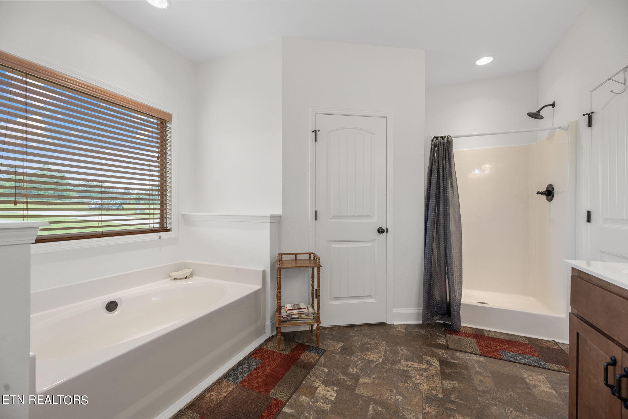 296 Shields Crossing Drive Bean Station, TN 37708 - Photo 18 of 52 a bathroom with a bathtub and a shower