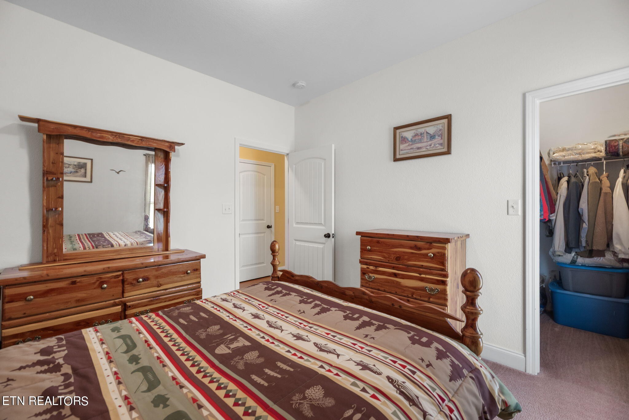 296 Shields Crossing Drive Bean Station, TN 37708 - Photo 20 of 52 a bedroom with a bed and a flat screen tv