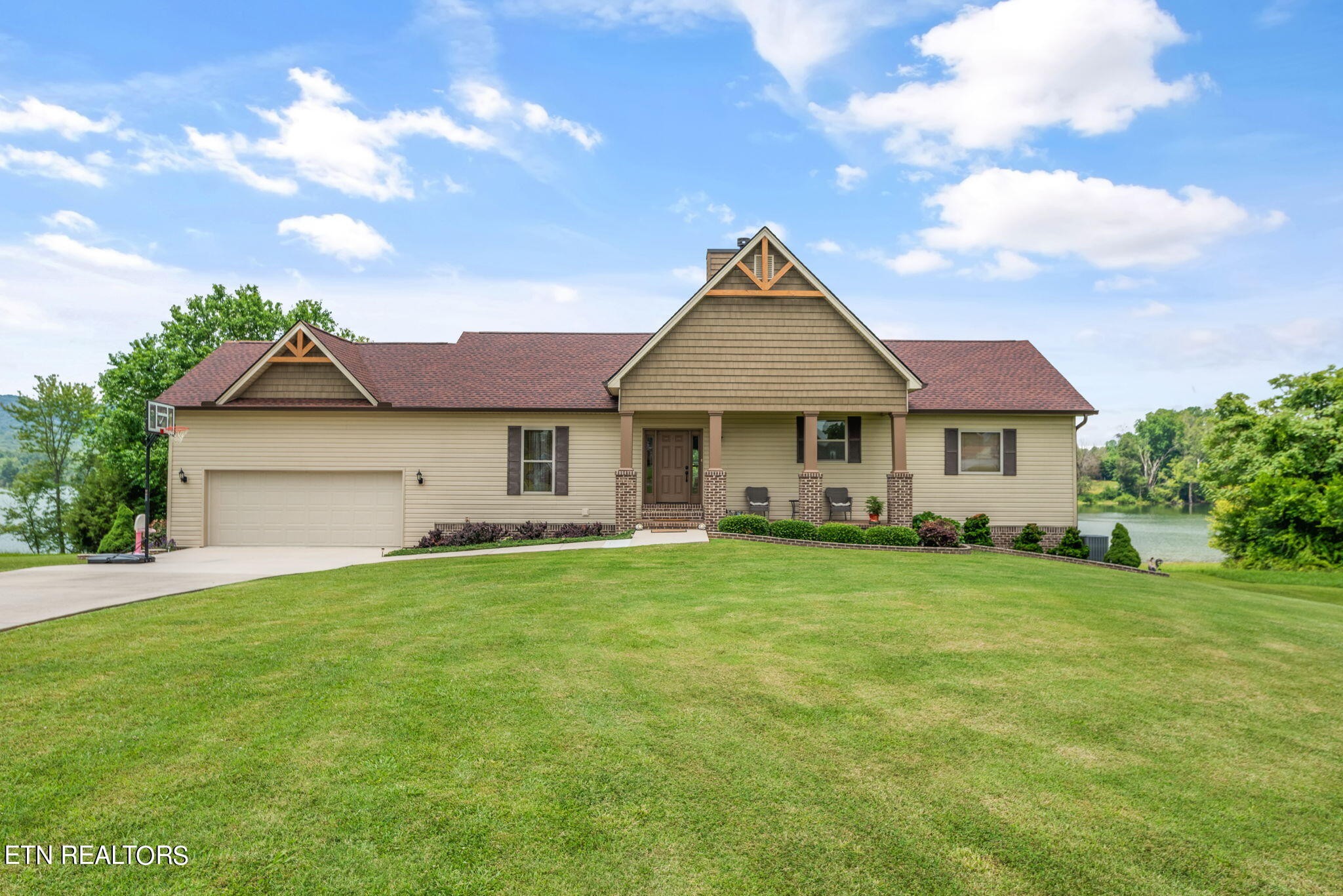 296 Shields Crossing Drive Bean Station, TN 37708 - Photo 2 of 52 a front view of a house with a garden