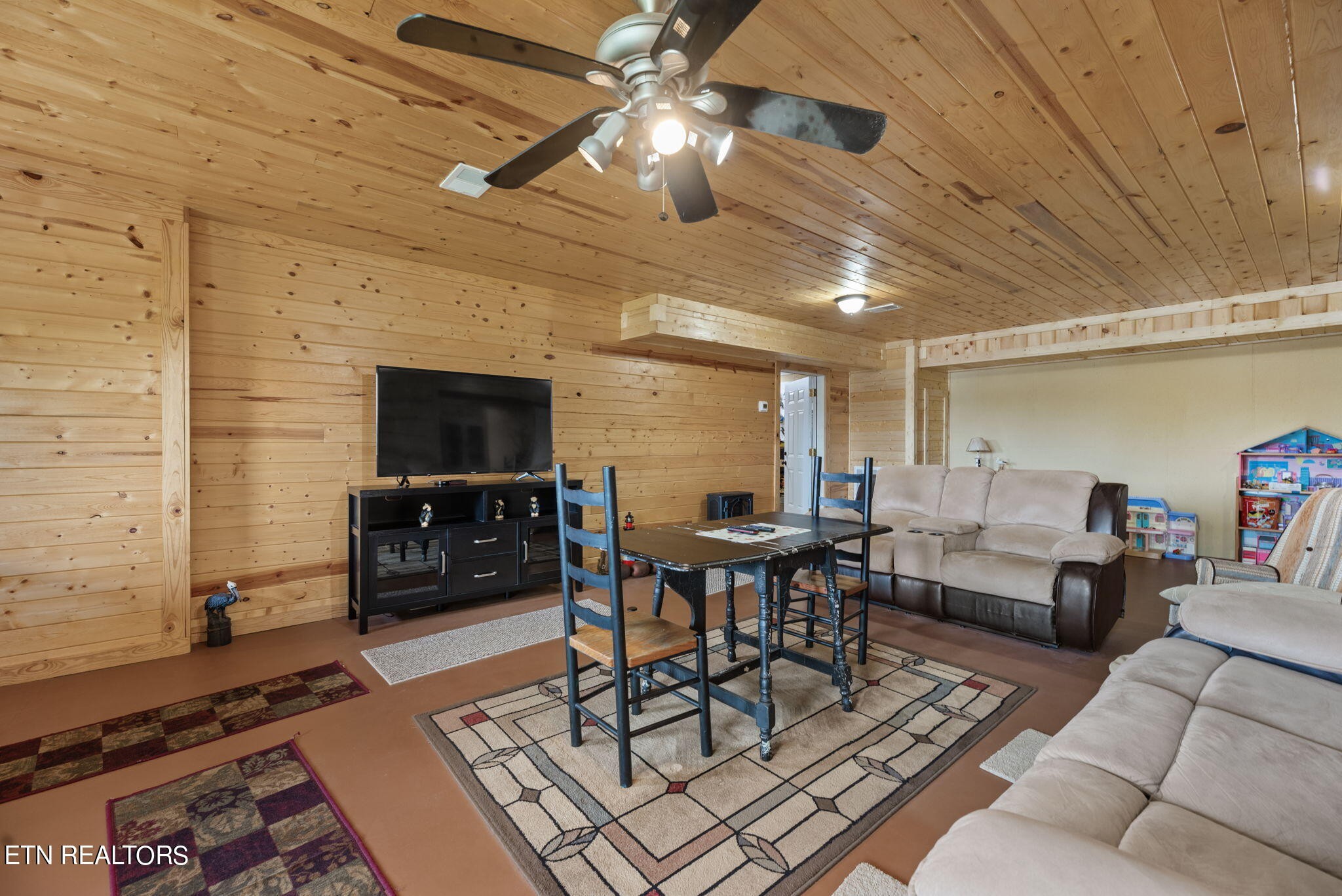296 Shields Crossing Drive Bean Station, TN 37708 - Photo 25 of 52 a living room with furniture and a flat screen tv