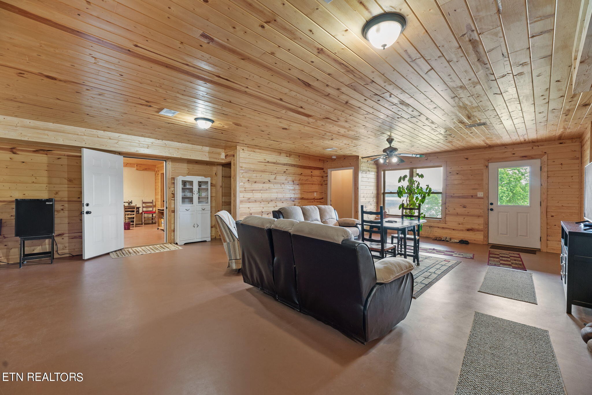 296 Shields Crossing Drive Bean Station, TN 37708 - Photo 27 of 52 a living room with furniture and a wooden floor