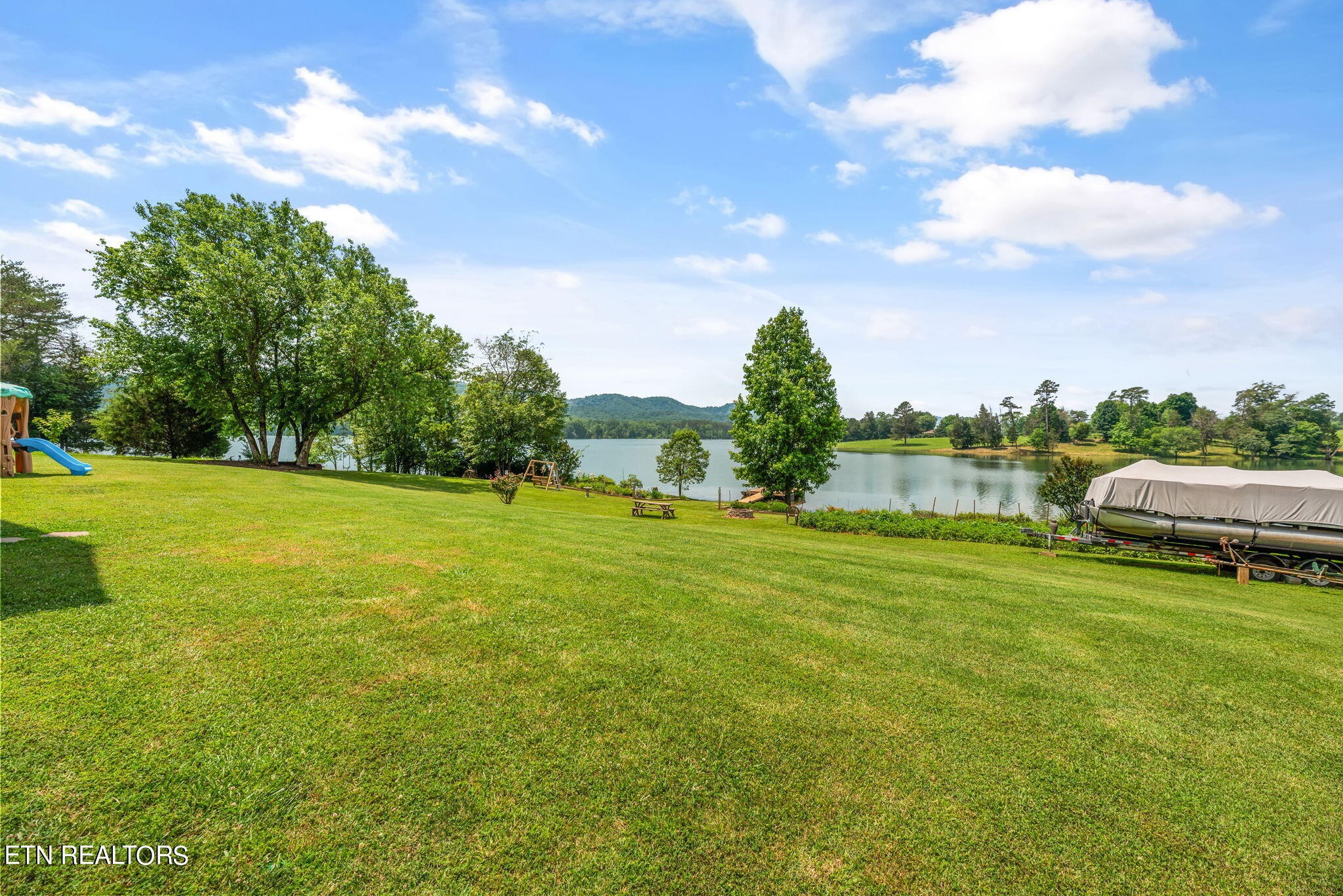296 Shields Crossing Drive Bean Station, TN 37708 - Photo 38 of 52 a view of a green field with wooden fence