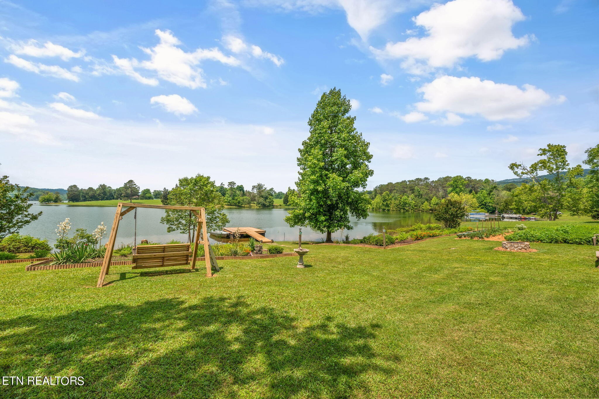 296 Shields Crossing Drive Bean Station, TN 37708 - Photo 40 of 52 a view of a golf course with a lake