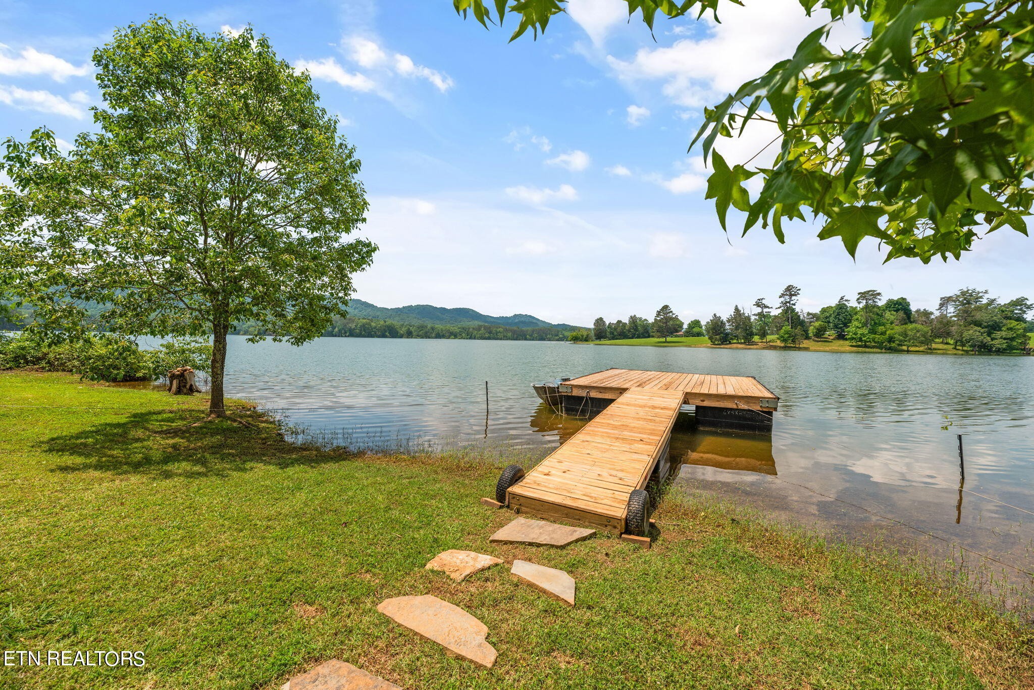 296 Shields Crossing Drive Bean Station, TN 37708 - Photo 42 of 52 a view of a lake with houses in background