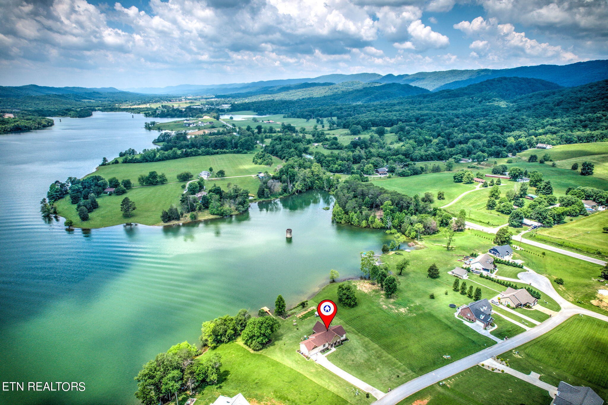296 Shields Crossing Drive Bean Station, TN 37708 - Photo 47 of 52 a view of a garden with a lake