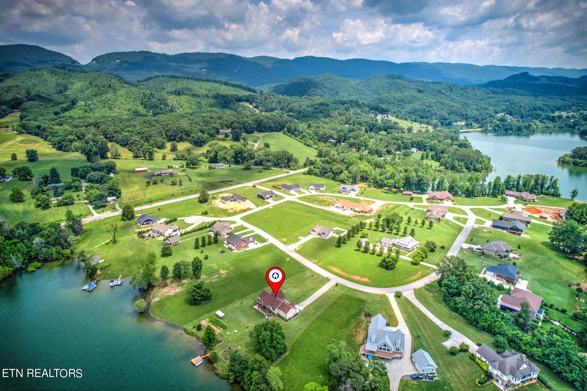 296 Shields Crossing Drive Bean Station, TN 37708 - Photo 48 of 52 a view of a lake with a mountain in the back