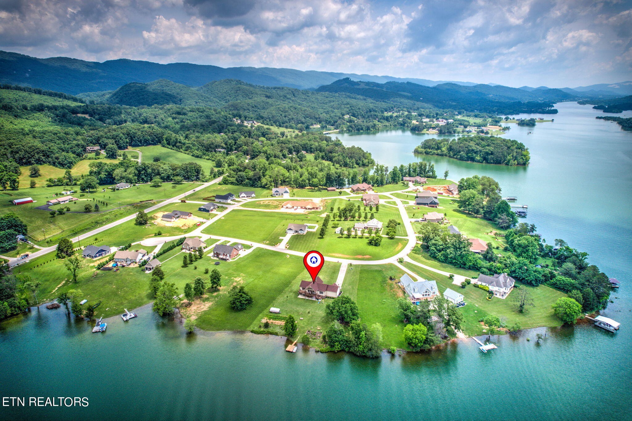 296 Shields Crossing Drive Bean Station, TN 37708 - Photo 49 of 52 a white house with a yard and lake view