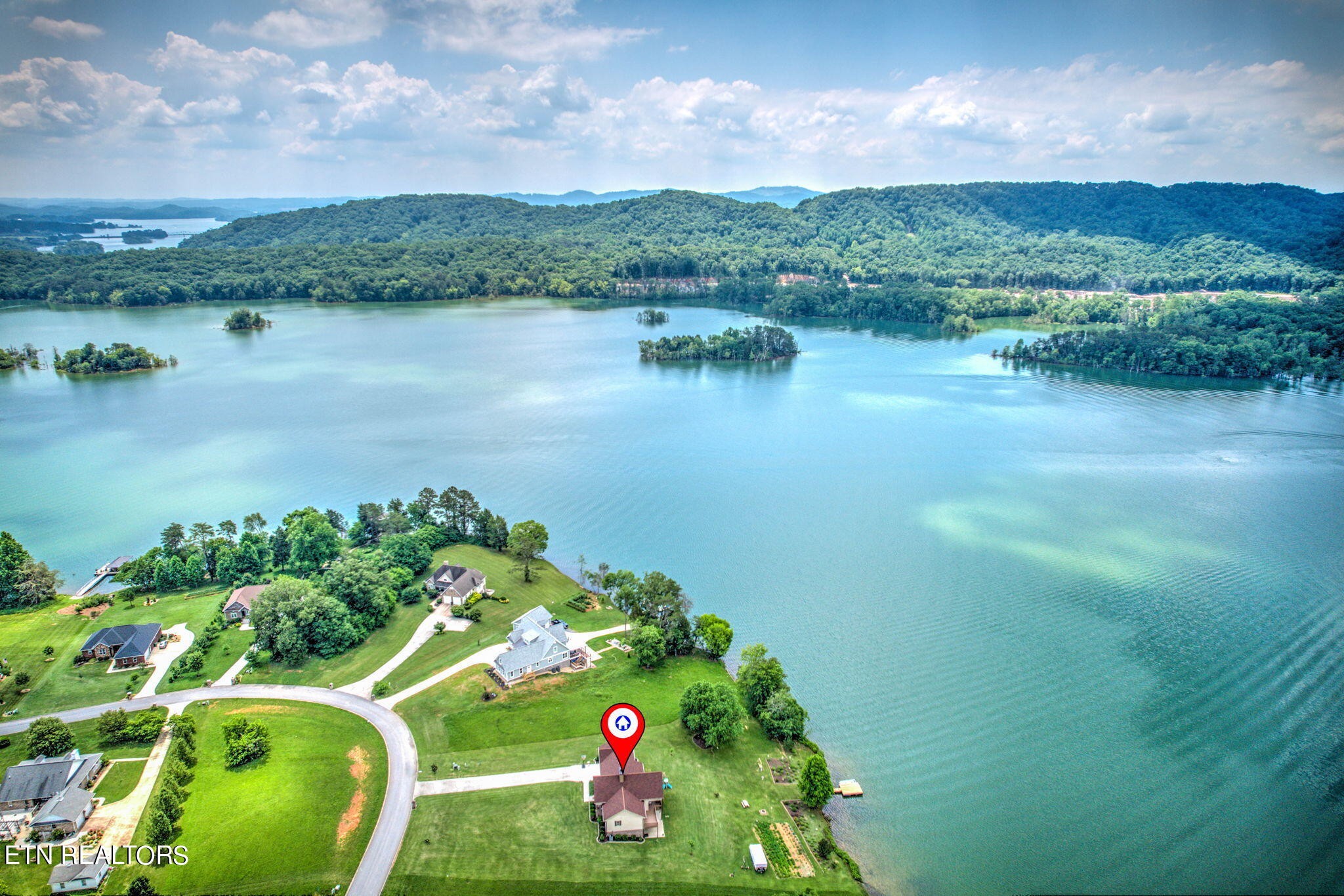 296 Shields Crossing Drive Bean Station, TN 37708 - Photo 52 of 52 a view of a lake with a mountain in the background