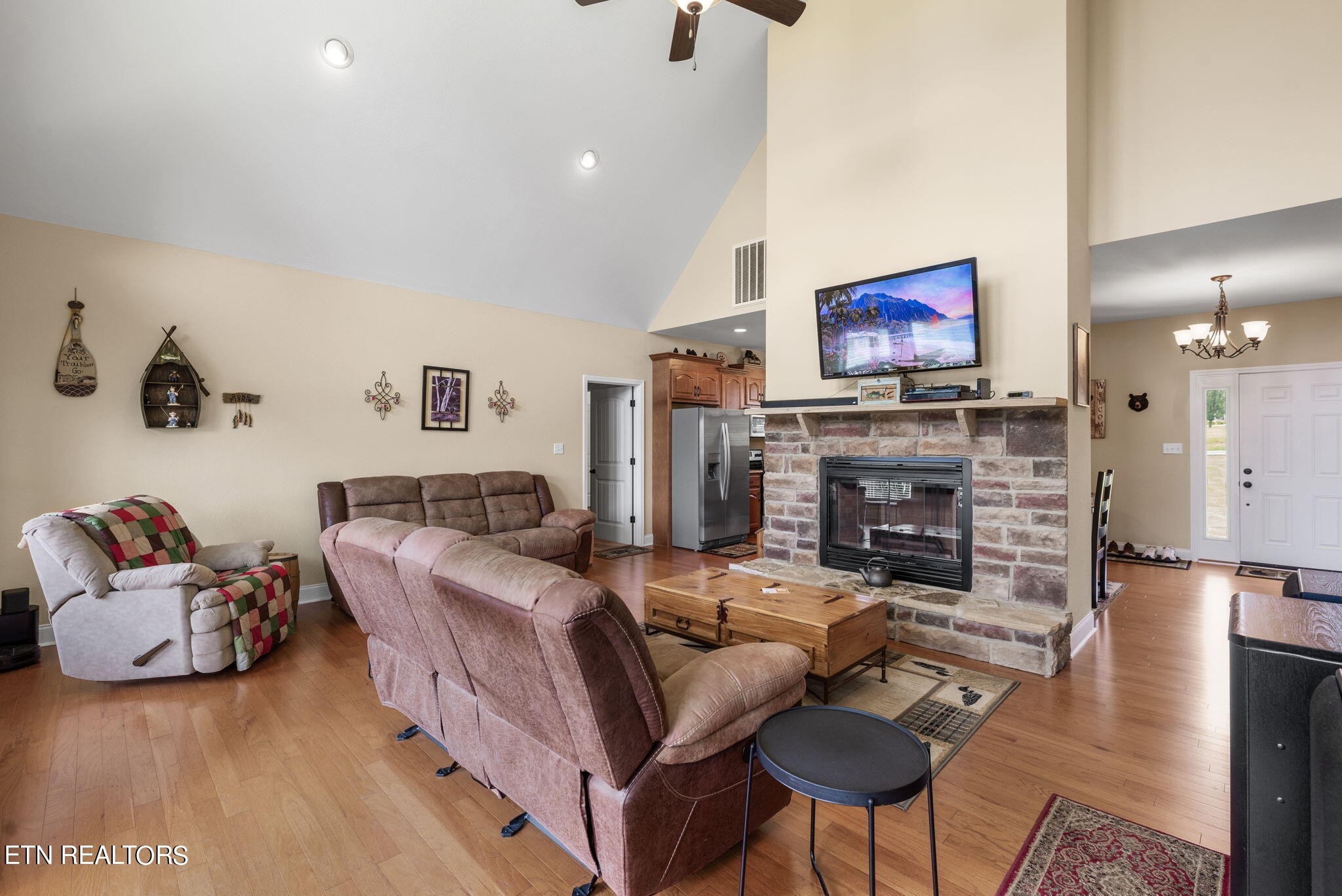 296 Shields Crossing Drive Bean Station, TN 37708 - Photo 8 of 52 a living room with furniture a fireplace and a flat screen tv