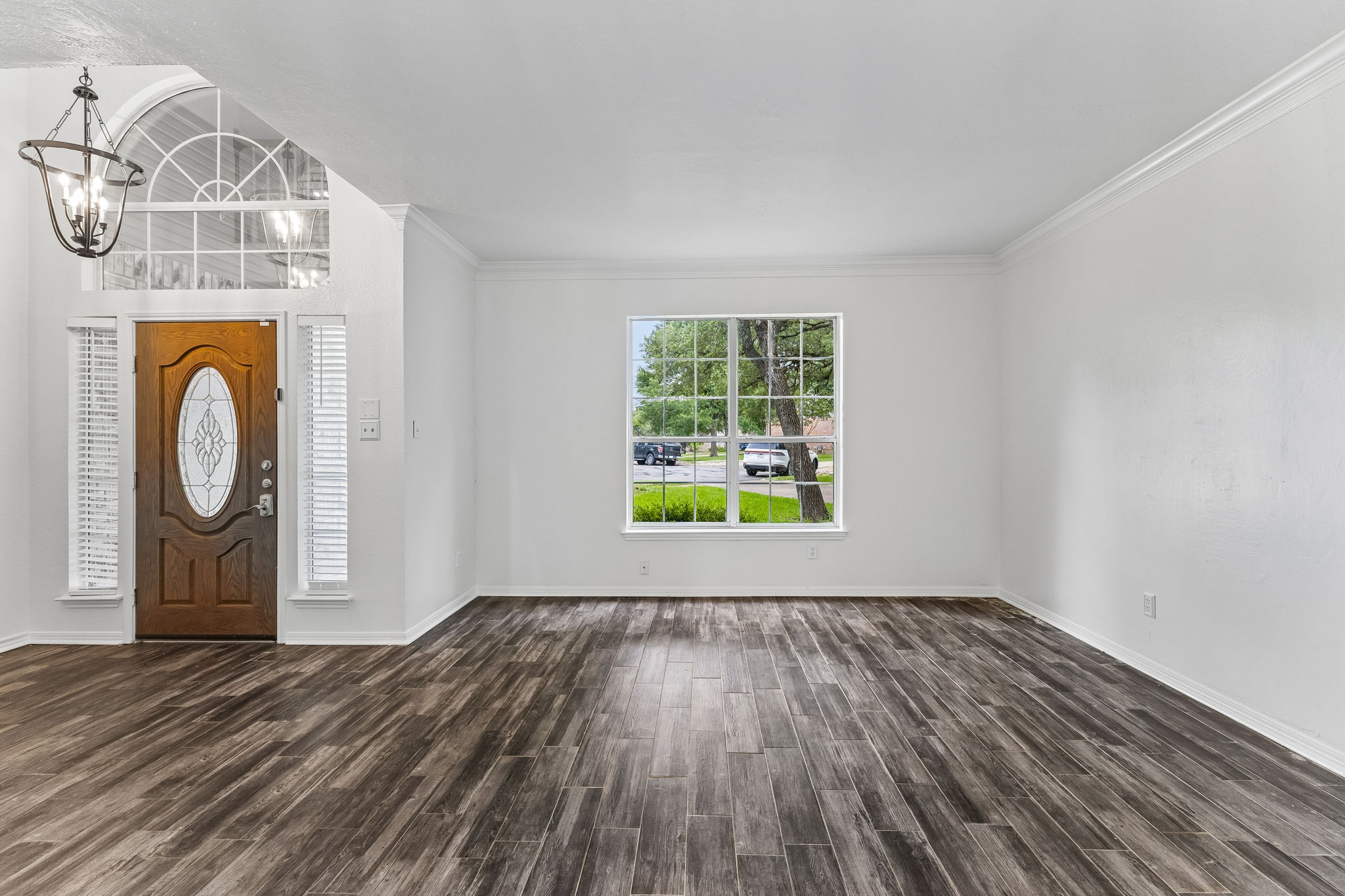 10400 O'Rourk Lane Austin, TX 78739 - Photo 22 of 33 a view of empty room with window and wooden floor