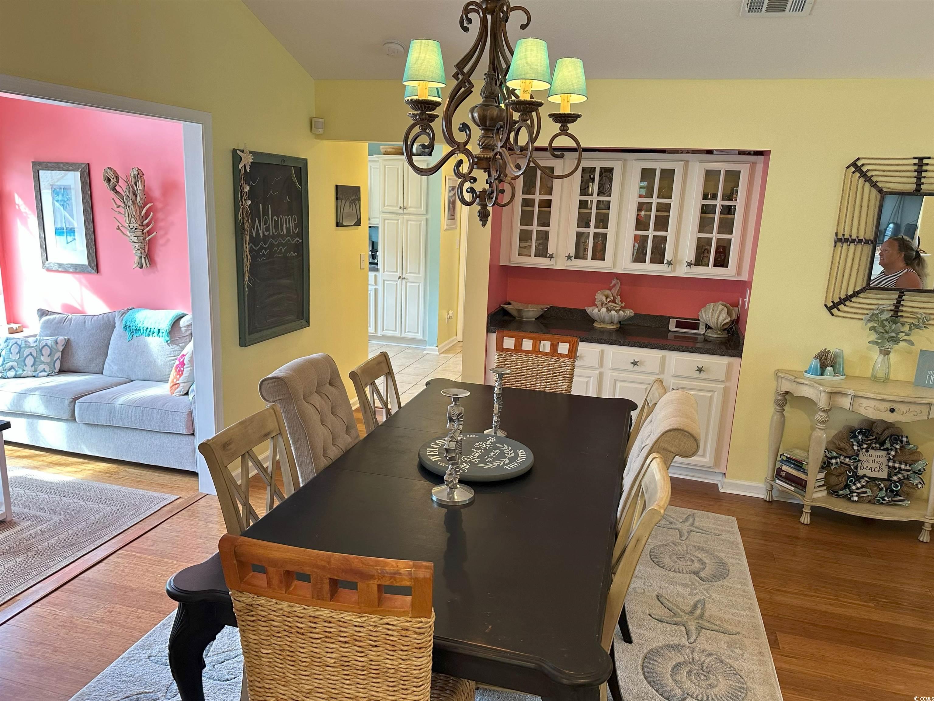 810 Marlin Court Murrells Inlet, SC 29576 - Photo 12 of 40 Dining space with a chandelier, wood finished floors, and lofted ceiling