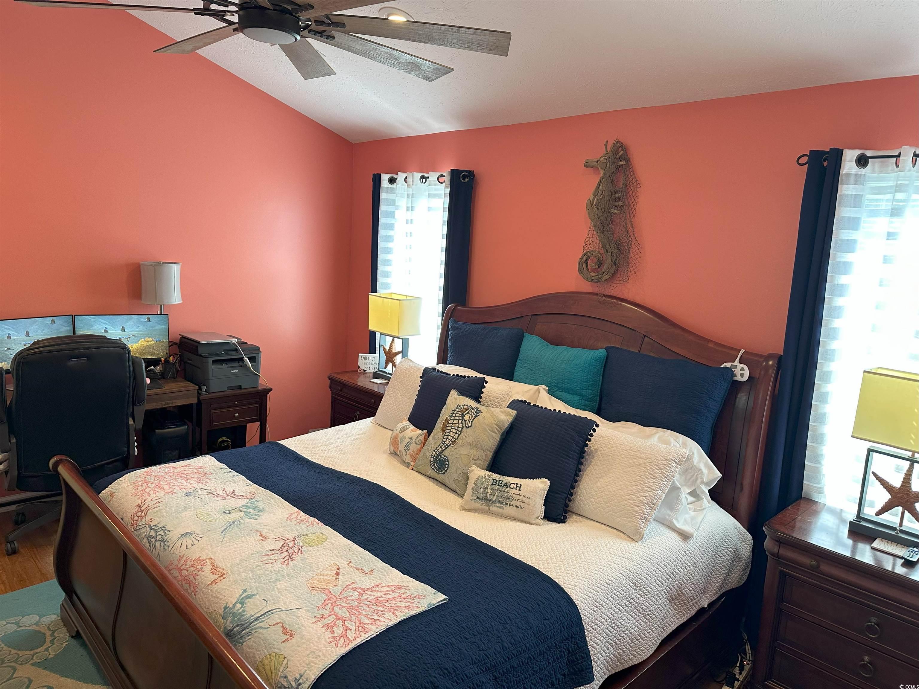 810 Marlin Court Murrells Inlet, SC 29576 - Photo 21 of 40 Bedroom with vaulted ceiling, wood finished floors, ceiling fan, and a desk