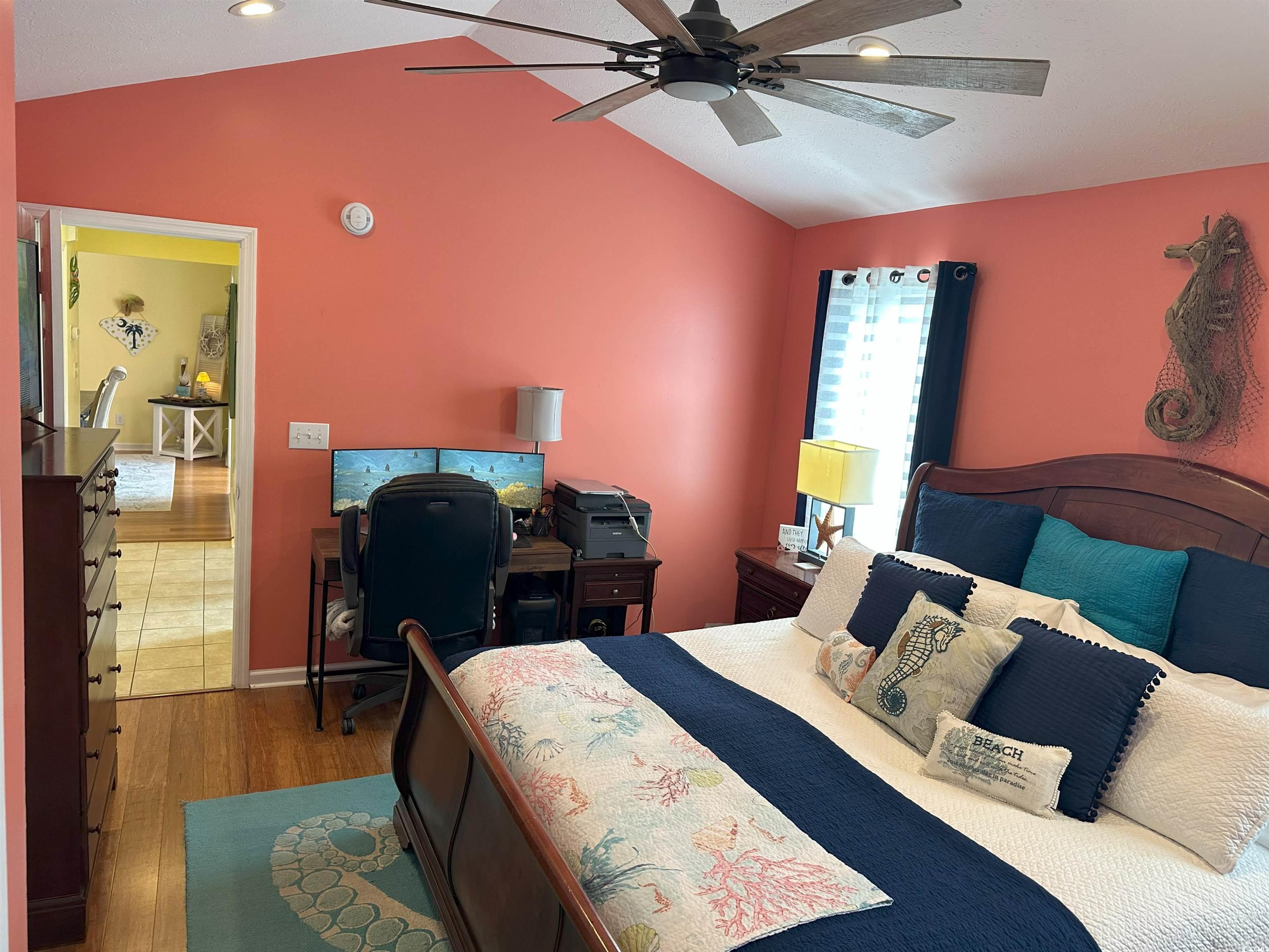 810 Marlin Court Murrells Inlet, SC 29576 - Photo 22 of 40 Bedroom featuring vaulted ceiling, wood finished floors, recessed lighting, an office area, and ceiling fan