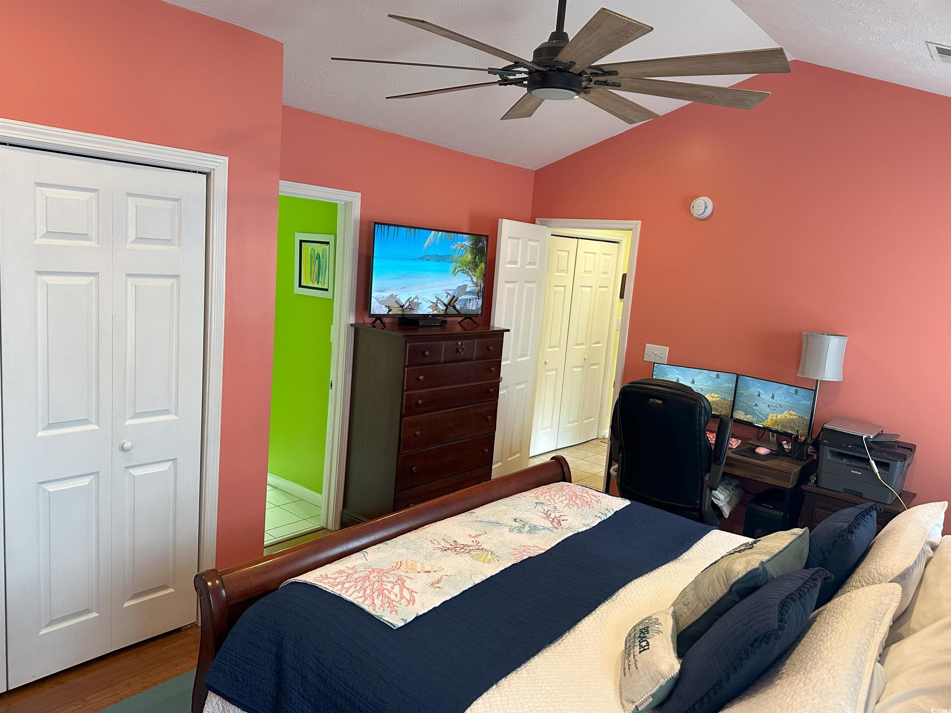 810 Marlin Court Murrells Inlet, SC 29576 - Photo 23 of 40 Bedroom with lofted ceiling, wood finished floors, and a ceiling fan