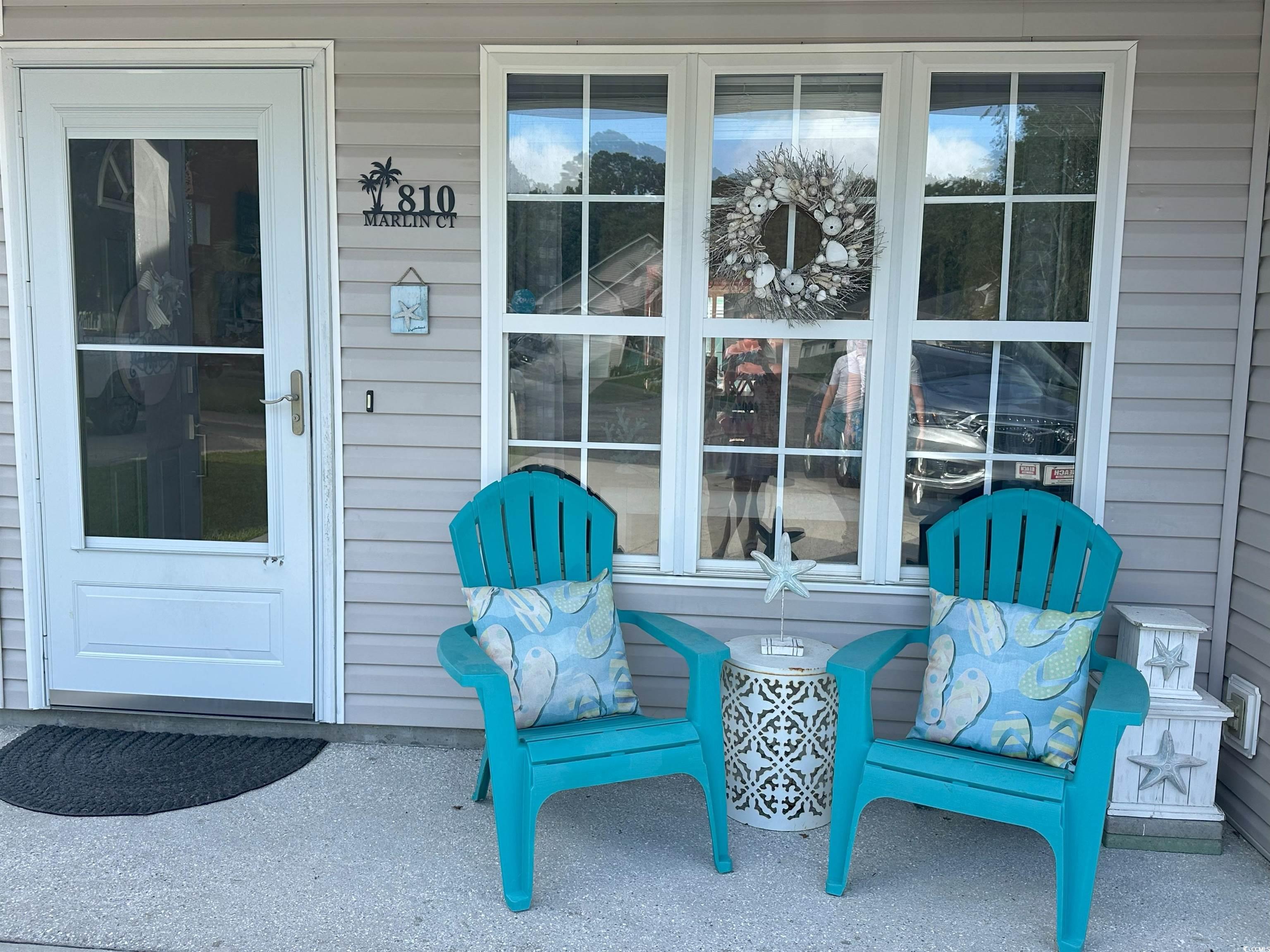 810 Marlin Court Murrells Inlet, SC 29576 - Photo 3 of 40 Enjoy the front porch for visiting with the neighbors or unwinding after a long day at the beach