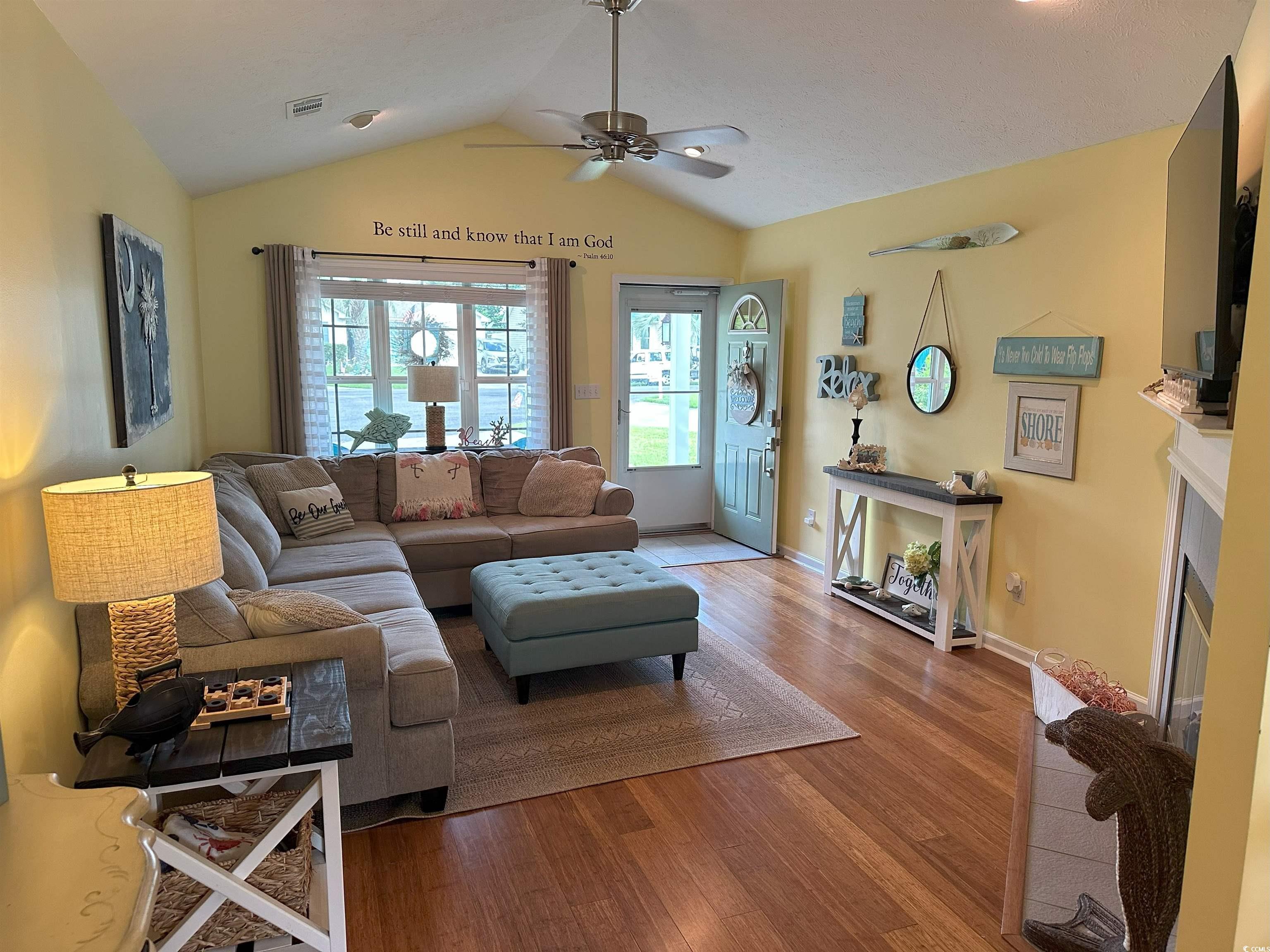 810 Marlin Court Murrells Inlet, SC 29576 - Photo 8 of 40 Living area with ceiling fan, lofted ceiling, wood finished floors, and a fireplace