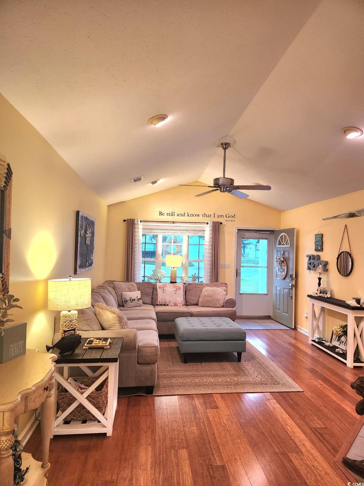 810 Marlin Court Murrells Inlet, SC 29576 - Photo 9 of 40 Living room featuring lofted ceiling, wood finished floors, and a ceiling fan