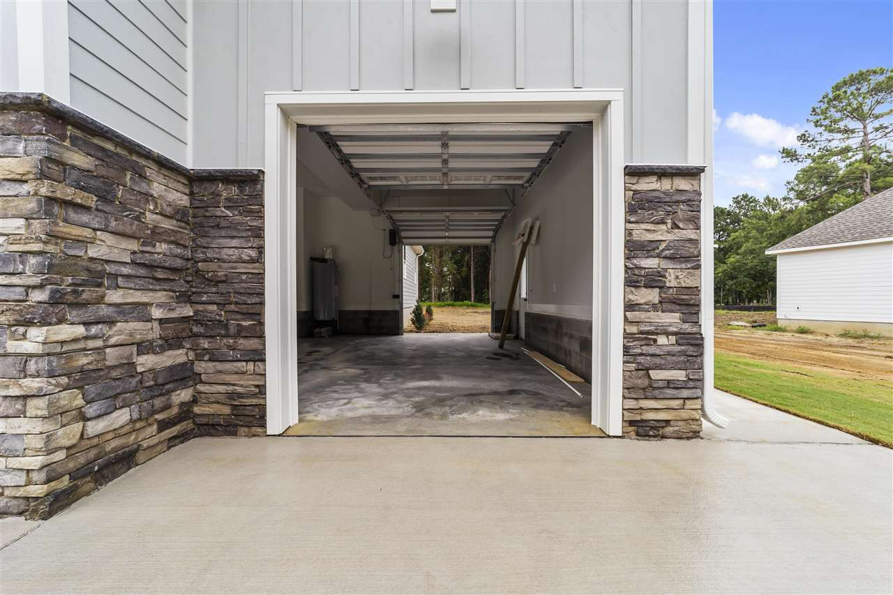 2332 Freedom Road Smithfield, NC 27577 - Photo 4 of 30 3rd Car Garage opens up to the backyard. Love it, love it...