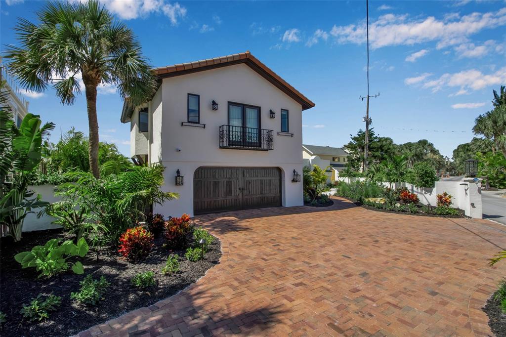 121 North Casey Key Road Osprey, FL 34229 - Photo 61 of 63 a front view of a house with a garden