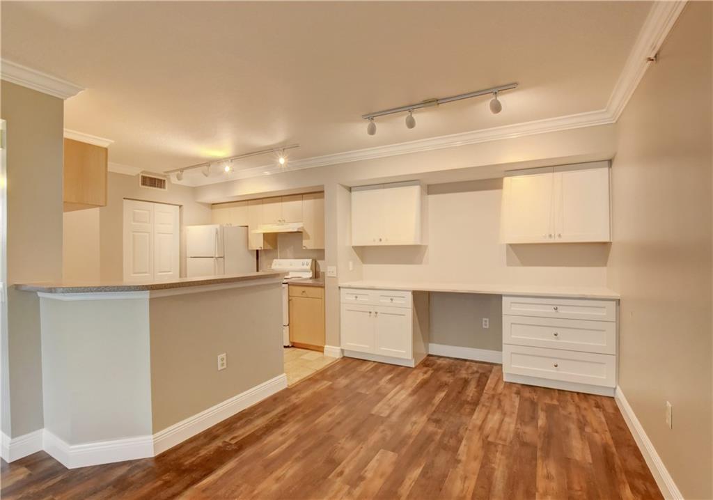 1312 Villa Lane, Unit 1312 Boynton Beach, FL 33435 - Photo 2 of 34 a kitchen with a refrigerator and window