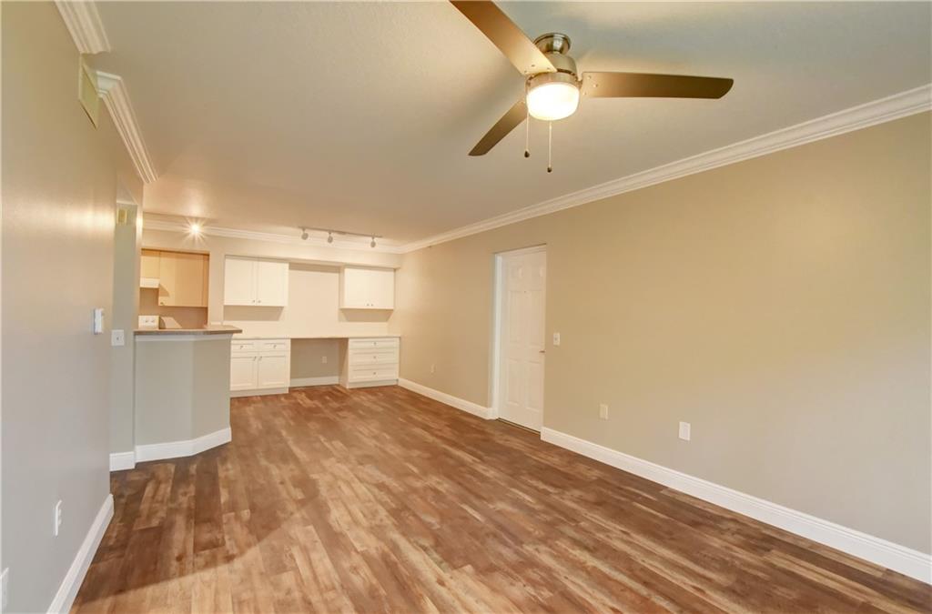 1312 Villa Lane, Unit 1312 Boynton Beach, FL 33435 - Photo 24 of 34 a view of a kitchen with a sink and cabinets