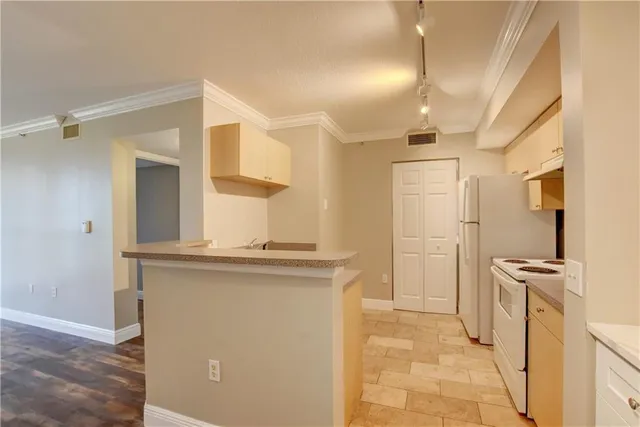 a view of a kitchen with a sink