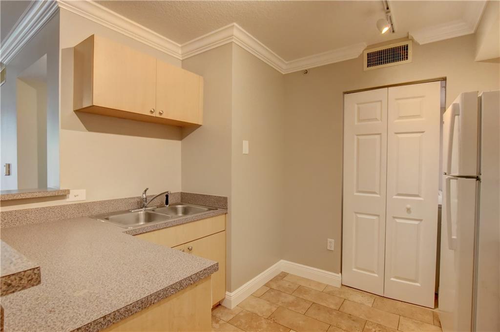 1312 Villa Lane, Unit 1312 Boynton Beach, FL 33435 - Photo 29 of 34 a bathroom with a sink and a mirror
