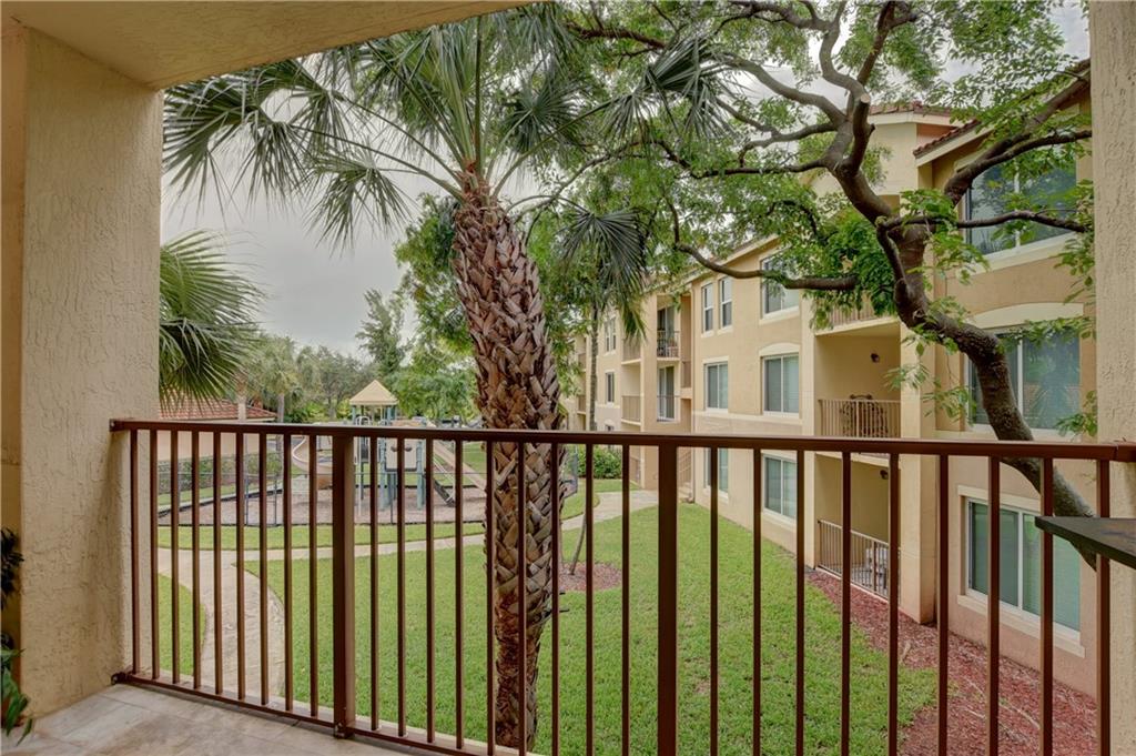 1312 Villa Lane, Unit 1312 Boynton Beach, FL 33435 - Photo 10 of 34 a view of a street from a balcony
