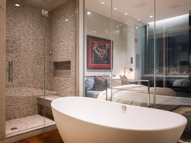 a large white tub sitting in a bathroom