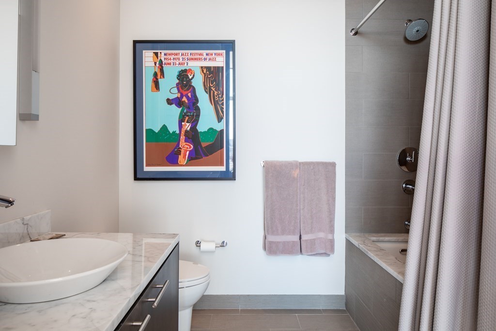 110 Stuart Street, Unit PH04 Boston, MA 02116 - Photo 25 of 36 a bathroom with a tub and sink