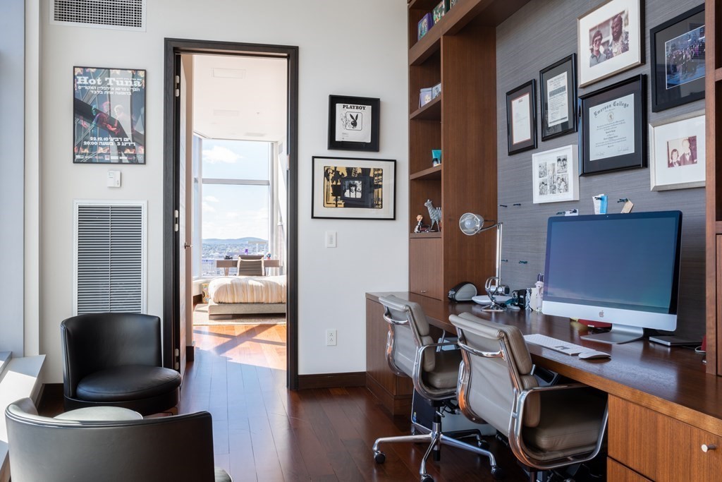 110 Stuart Street, Unit PH04 Boston, MA 02116 - Photo 26 of 36 a view of a workspace with furniture and a window