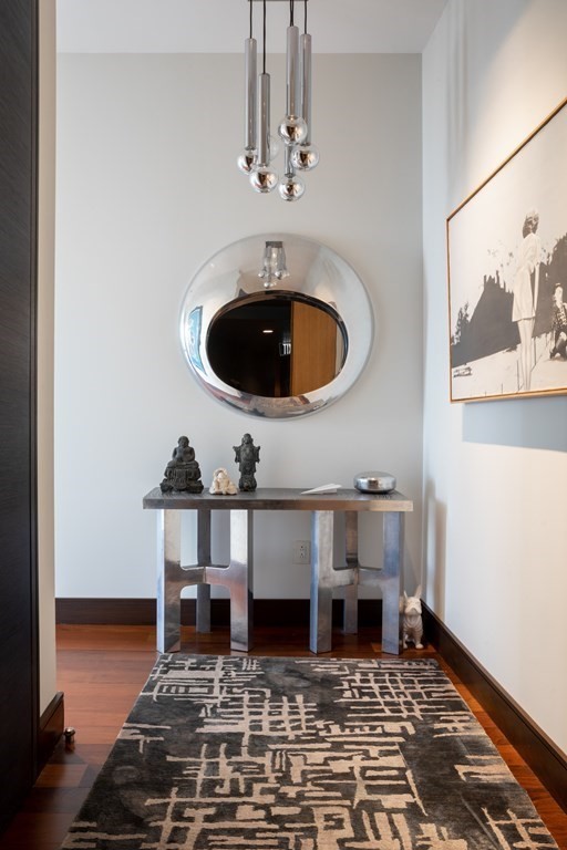 110 Stuart Street, Unit PH04 Boston, MA 02116 - Photo 27 of 36 a living room with a table and chairs