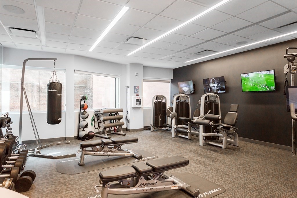 110 Stuart Street, Unit PH04 Boston, MA 02116 - Photo 36 of 36 a room with gym equipment and a large window