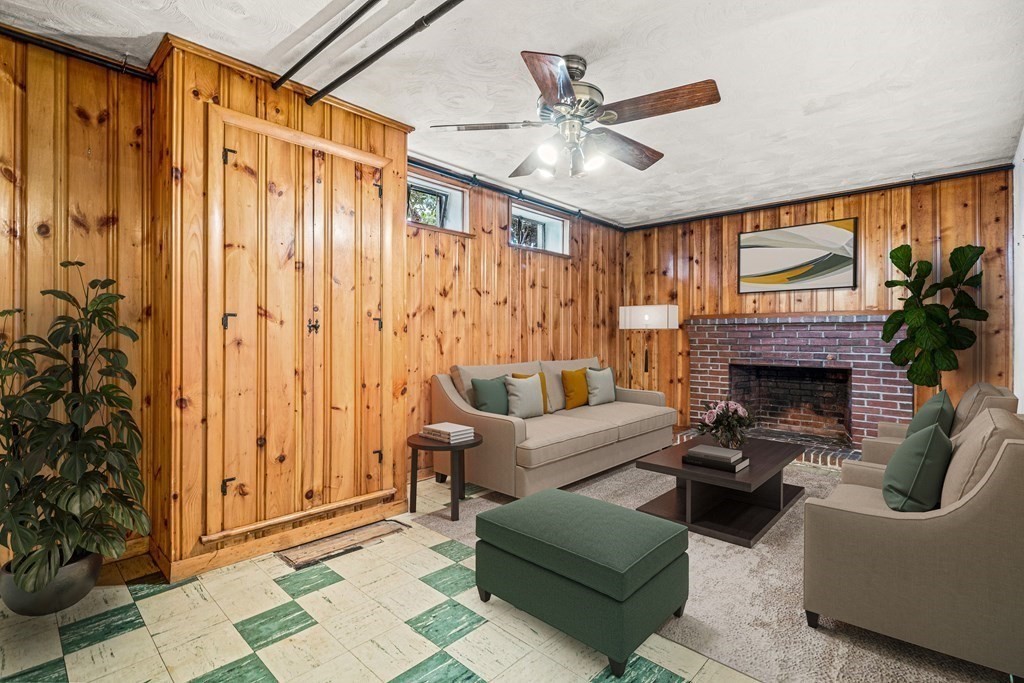277 Webster Street Needham, MA 02494 - Photo 15 of 17 a living room with furniture a large window and a fireplace