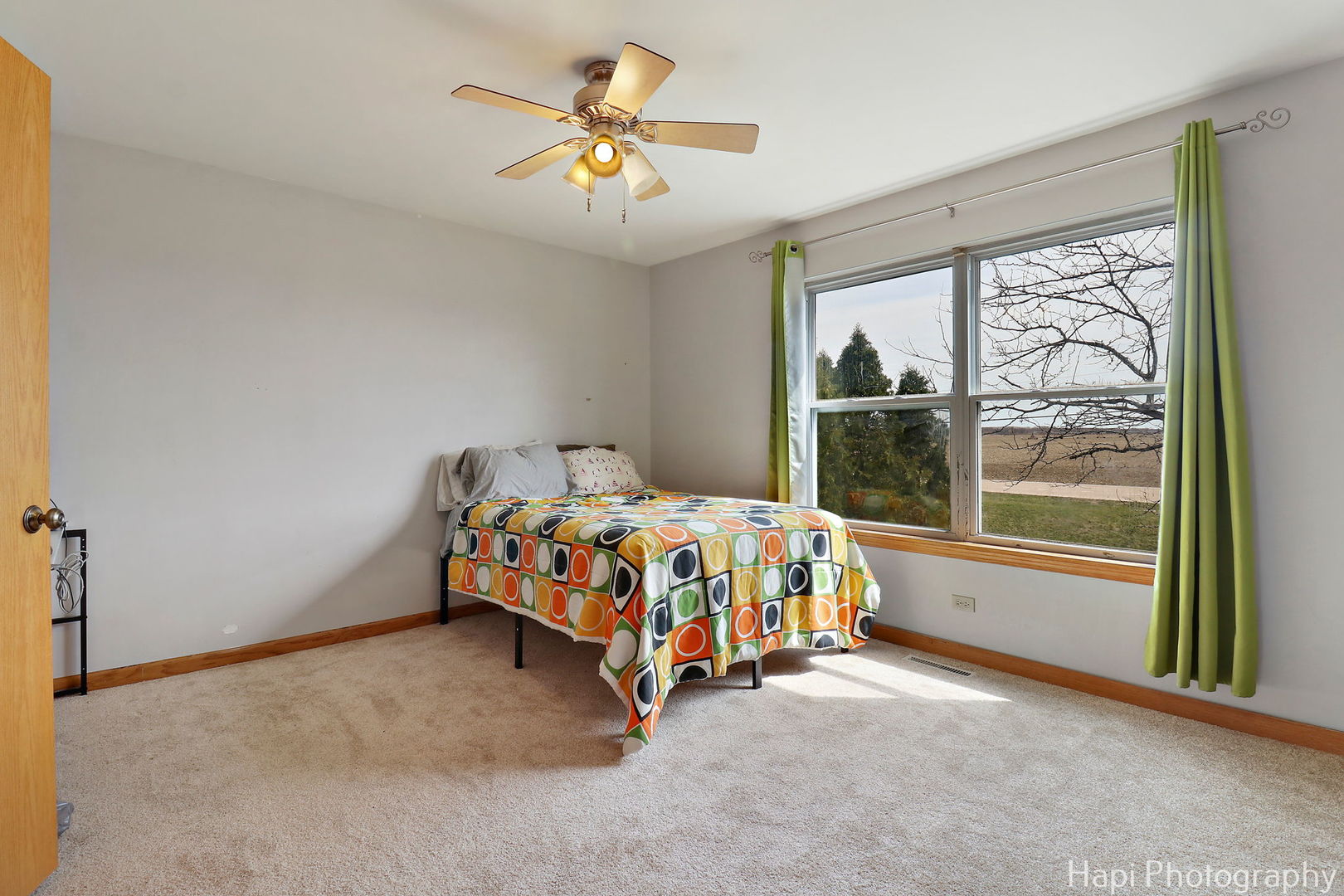 809 Village Circle Marengo, IL 60152 - Photo 11 of 19 a bed sitting in a room next to a window