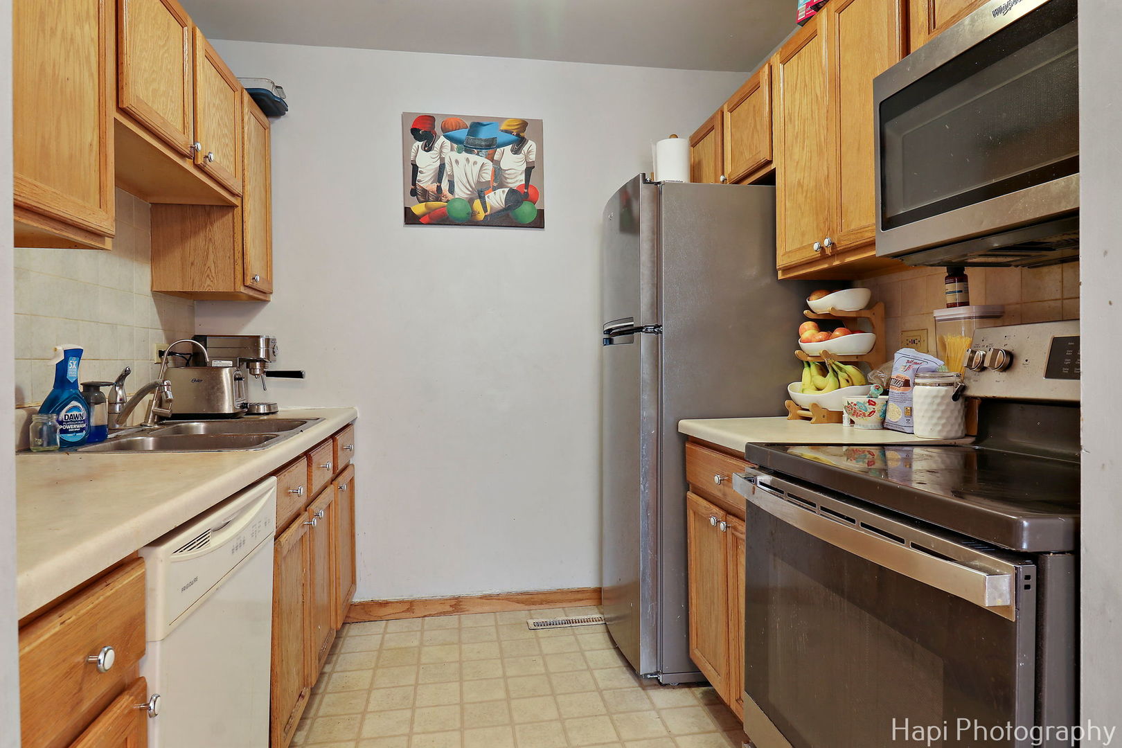 809 Village Circle Marengo, IL 60152 - Photo 2 of 19 a kitchen with stainless steel appliances granite countertop a refrigerator and a stove top oven