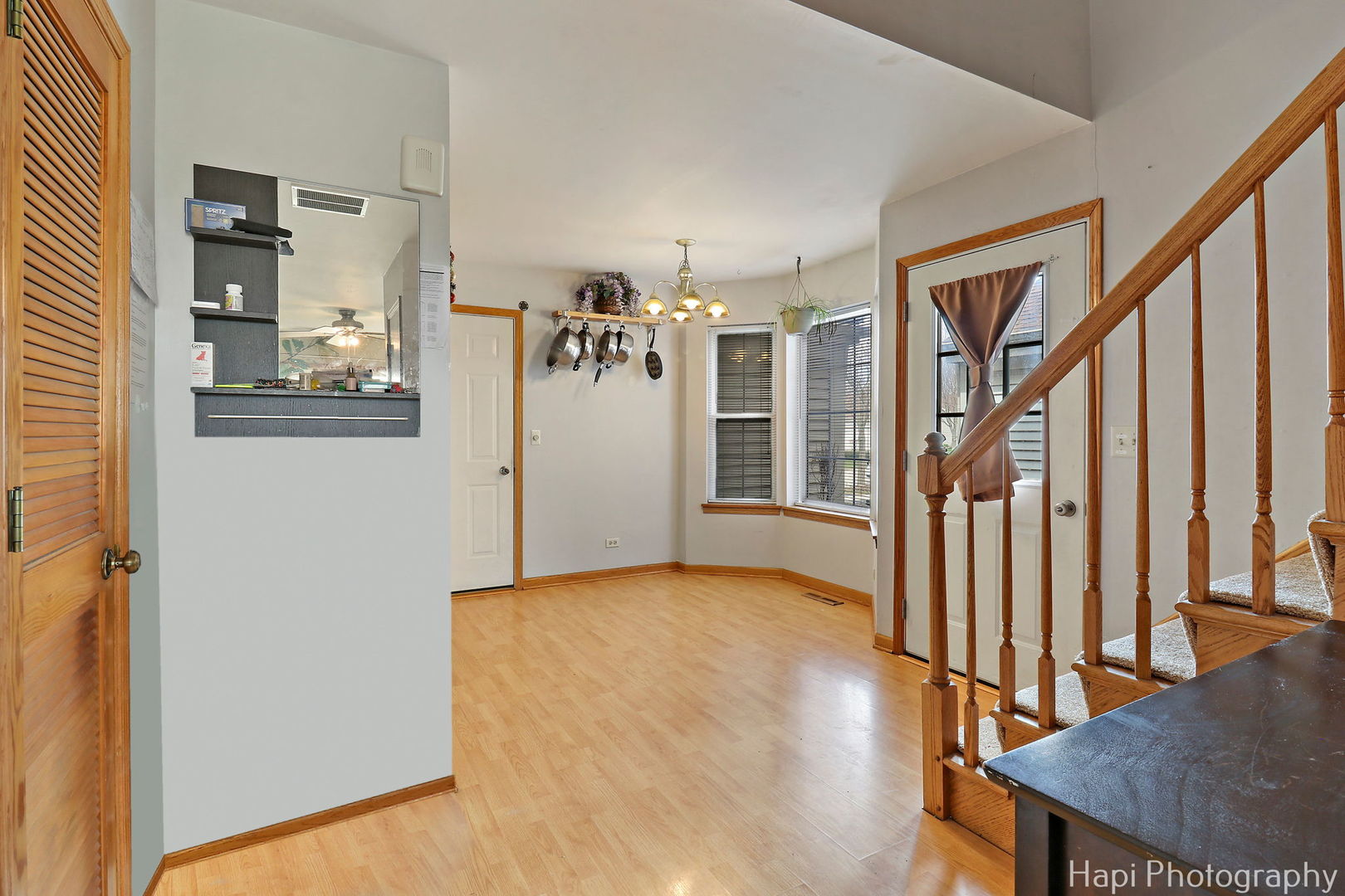 809 Village Circle Marengo, IL 60152 - Photo 6 of 19 a view of a livingroom with wooden floor and stairs