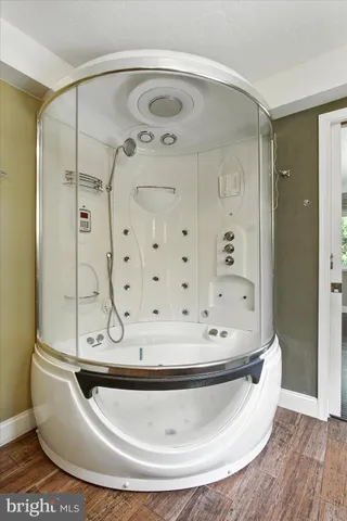 a view of room with window and wooden floor