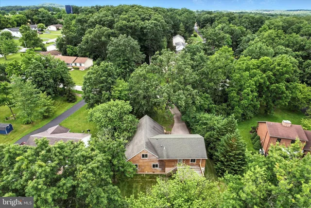 an aerial view of house with yard